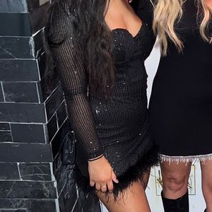 Sequin dress with feather trim from Windsor.